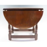 An oak drop-leaf occasional table, late 20th Century, 49 cm x 74 cm x 48 cm