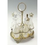 A late 19th / early 20th Century condiment set, the glass cruets being wheel-cut in depiction of