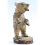 A mid 20th Century Swiss treen carved wooden bear, marked "Berne. SW, 1953" to base, 12 cm