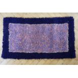 A hand crafted hooky mat / rag rug, 116 x 67 cm