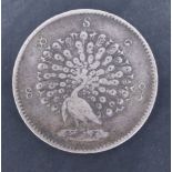 An 1853 (Mindon Min) Myanmar 1 Kyat silver coin