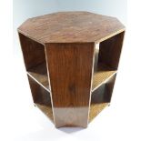 An Art Deco oak occasional table having canted corners and two undershelves, 47.5 (widest) x 50 cm