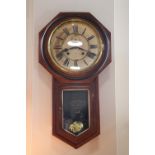 A late 19th Century Ansonia mahogany drop-dial wall clock, 90 cm