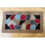 A hand crafted hooky mat / rag rug, 127 x 65 cm