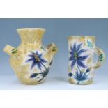 A mid-20th-Century French hand painted Decor Maid studio pottery two handled vase together with a