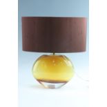 An amber studio glass table lamp, 44 cm