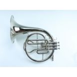 A cased late 20th Century silver plated 'Tristar' French horn, including mouthpiece, music holder,