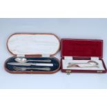 An Edwardian cased silver and mother-of-pearl Christening set, (knife associated), together with a