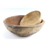 Two 19th Century turned sycamore dairy bowls, the larger having incised lines to the exterior, (