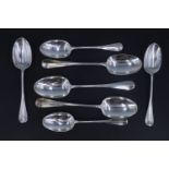 Seven late Victorian silver rat tail spoons, comprising three table and four desert spoons, having