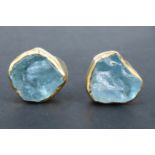A pair of late 20th Century baroque aquamarine stud earrings, each incorporating a piece of rough