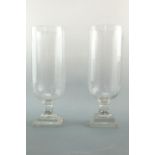 An uncommonly tall pair of Victorian cut glass vases, of footed round-bottomed cylindrical form,