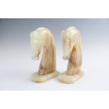 A pair of vintage onyx bookends modelled as chess knights, 11 x 6.5 x 19 cm