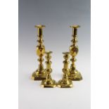 Two pairs of Victorian brass candlesticks, including 'King of diamonds' style, tallest 31.5 cm