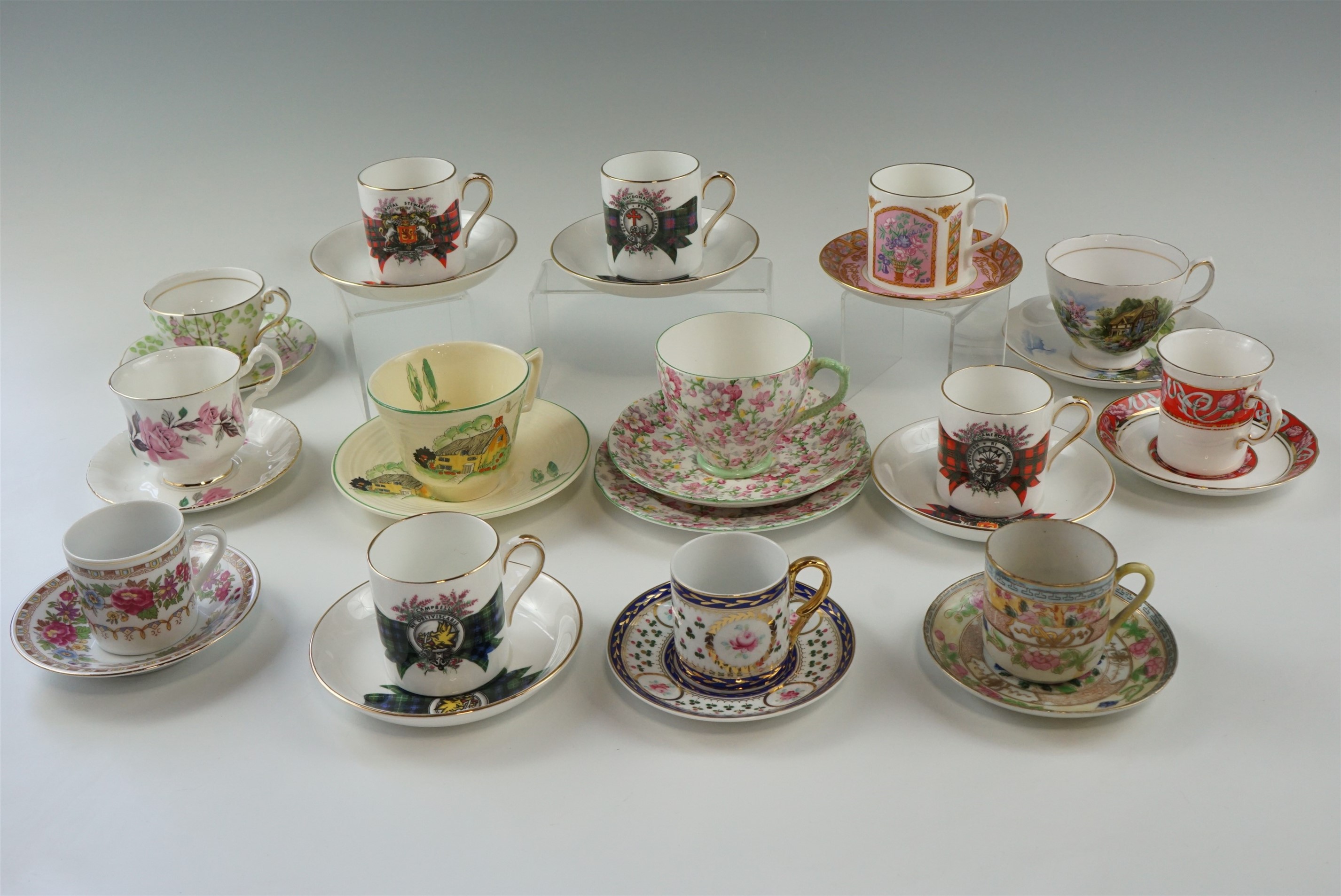 A group of cabinet cups and saucers, including four Royal Grafton Scottish clan pattern, Royal