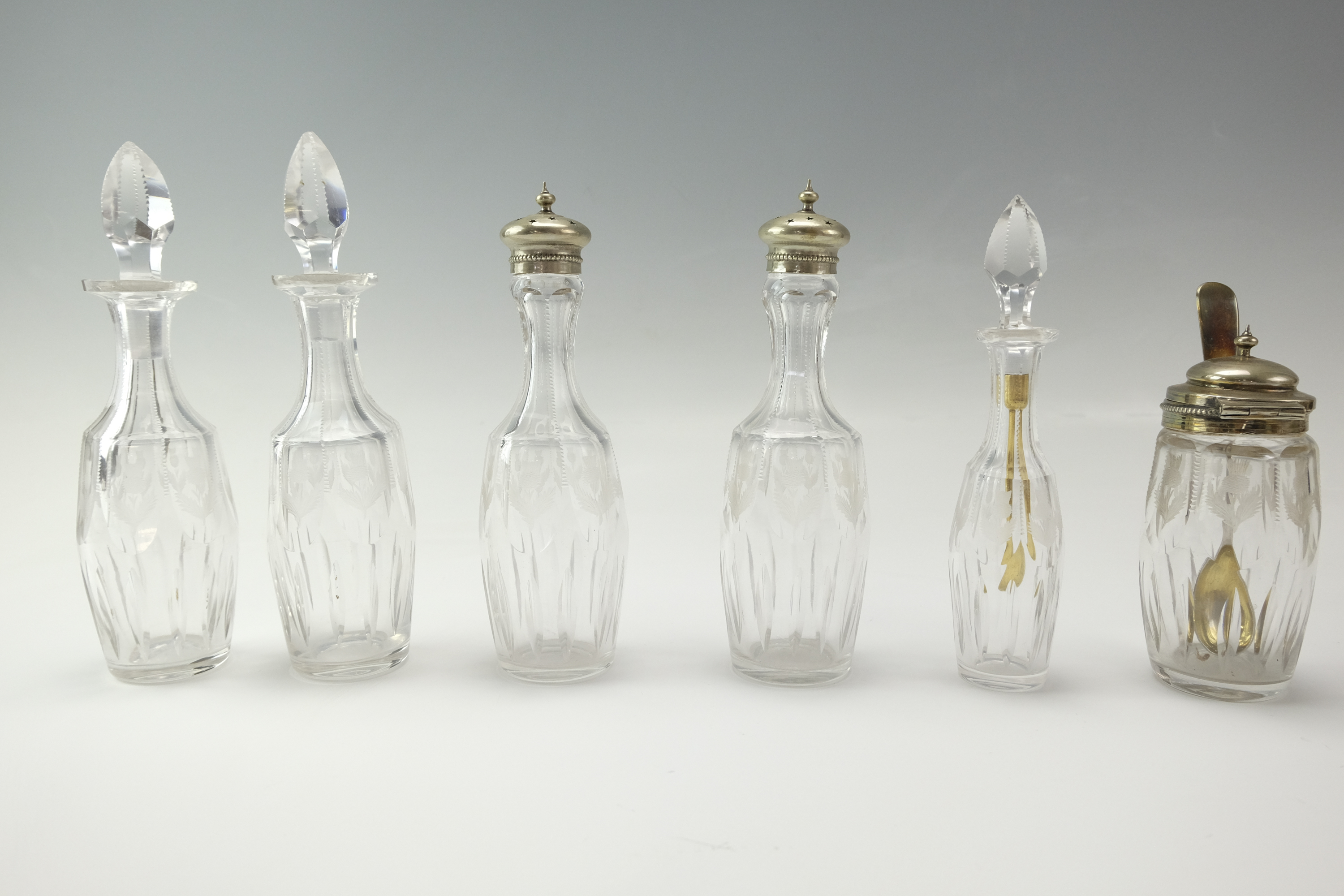 A late 19th / early 20th Century condiment set, the glass cruets being wheel-cut in depiction of - Image 2 of 5