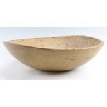 A 19th Century turned sycamore dairy bowl, 39 cm diameter