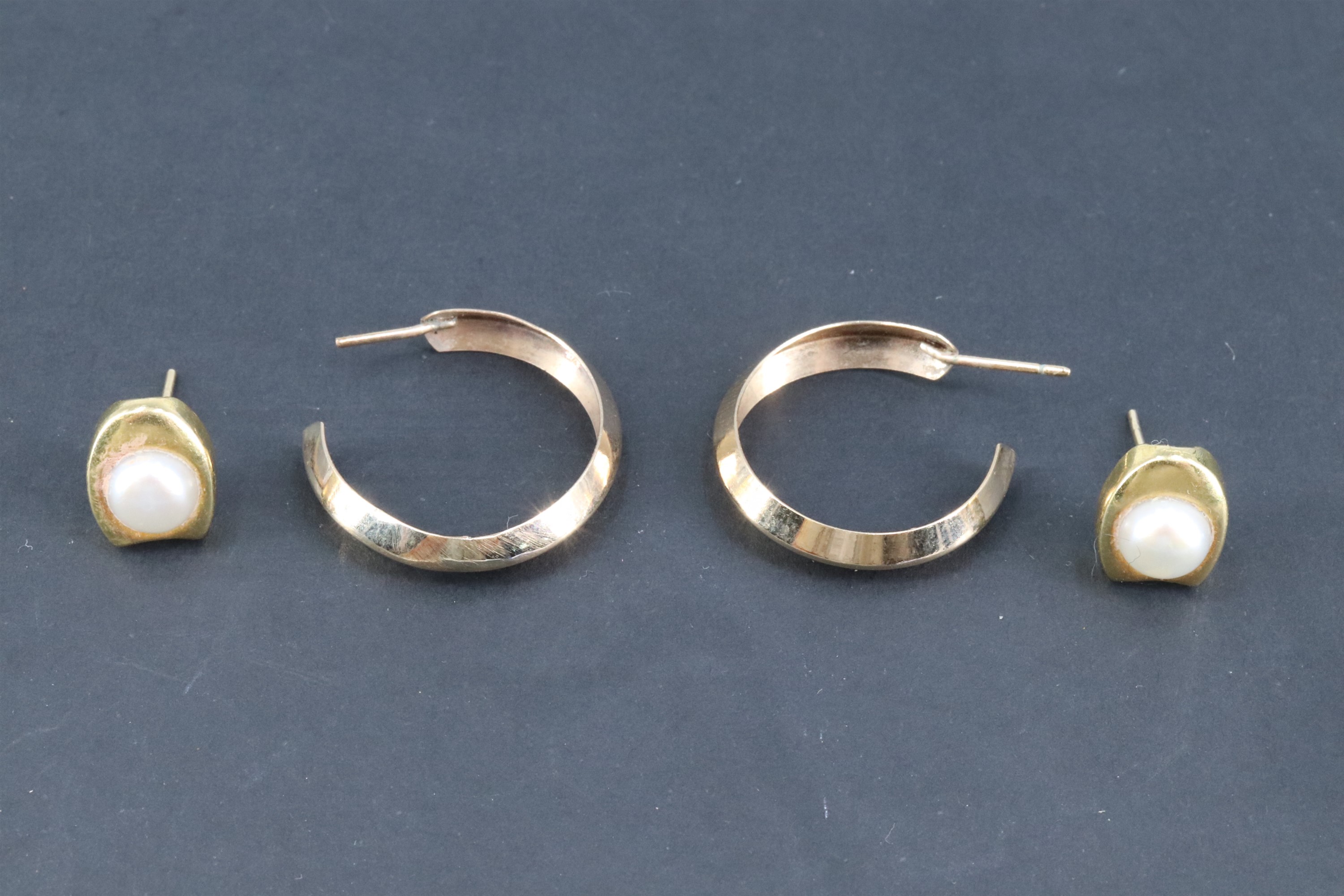 Two pairs of late 20th Century yellow metal earrings, comprising a pair set with 6 mm pearls, and