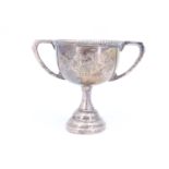 A small silver two handled trophy, 6.5 cm, 36 g