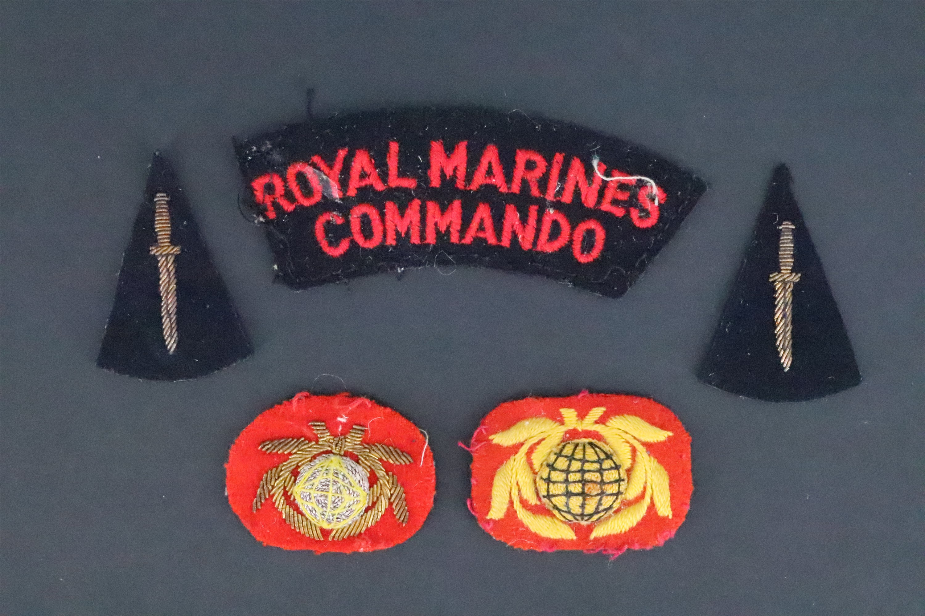 A small group of post-War Royal Marines Commando cloth insignia