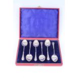 A late Victorian cased set of silver tea / coffee spoons, each having a twisted stem and fancy