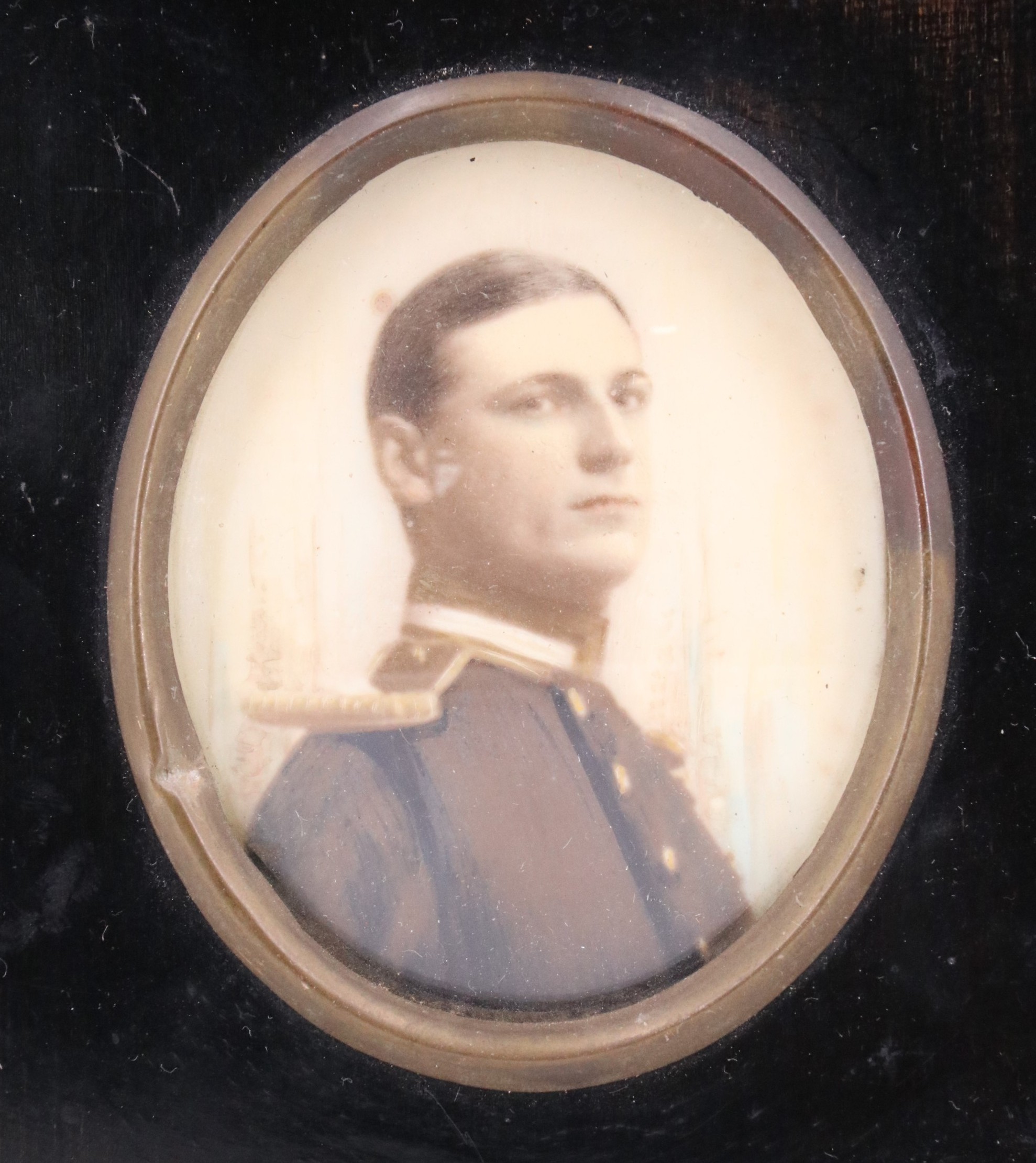 A hand tinted photographic portrait of a Naval Officer in full dress, late 19th / early 20th