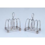 A pair of late Victorian electroplate four-slice toast racks retailed by Harrod's, 8.5 cm x 5.5 cm x