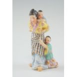 A small late 19th / early 20th Century porcelain figure group, modelled as an Oriental mother with