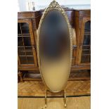 A fancy gilt framed oval cheval mirror, mid-to-late 20th Century, 135 cm