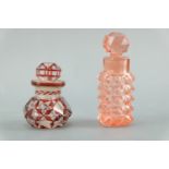 Two Victorian scent bottles, each having ground a glass stopper, one cut and ruby flashed, tallest