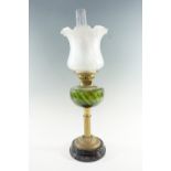 A Victorian columnar brass and emerald glass oil lamp, having a duplex coronet burner and an