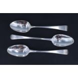 A pair of George III silver Old English pattern dessert spoons, bearing engraved crests, William