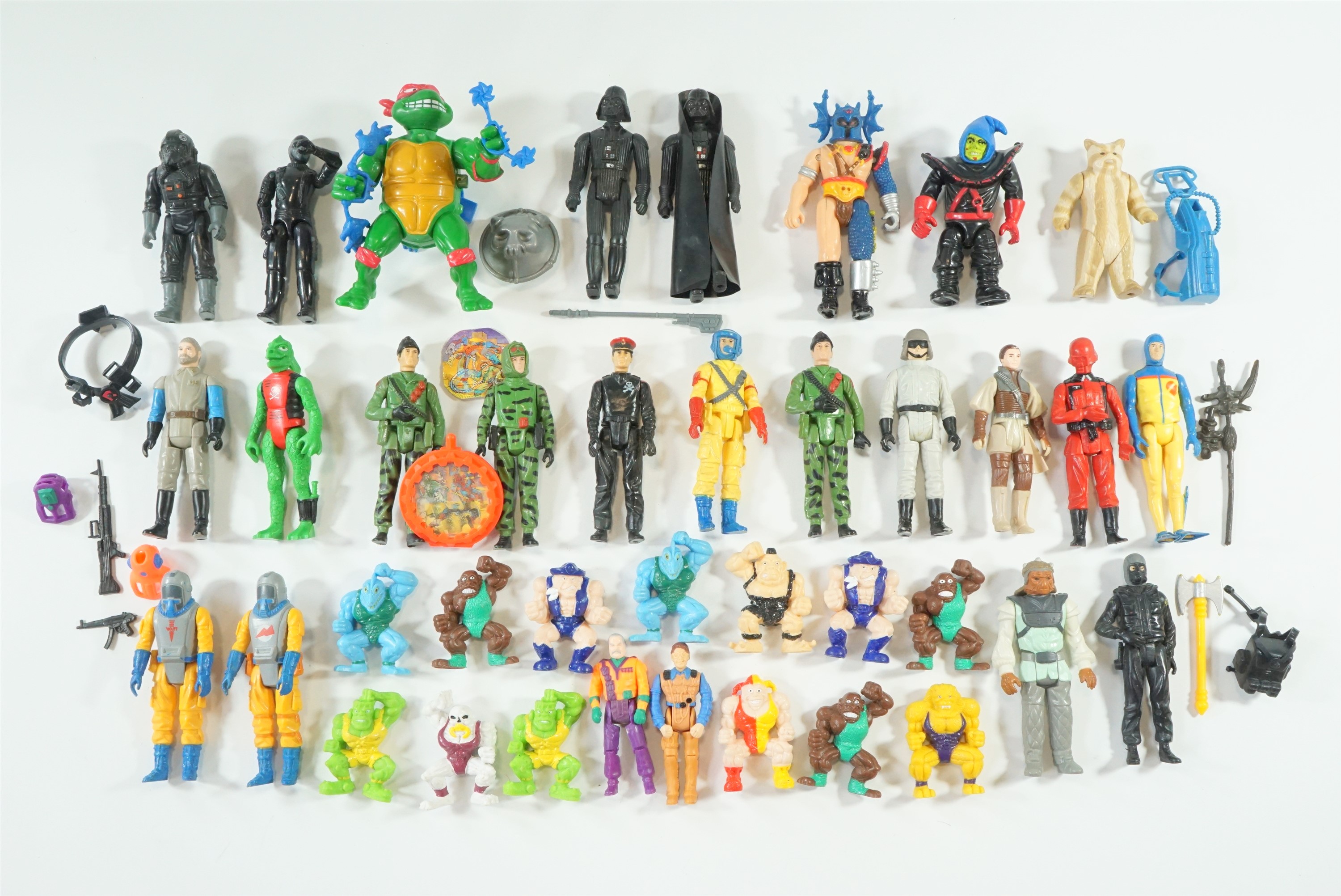 A group of vintage composition action figures, including Star Wars, Monsters in My Pocket (1995),