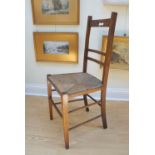 An early 20th Century rush-seated oak bedroom chair