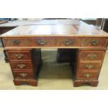 A reproduction George III style twin pedestal desk, 122.5 x 61.5 x 78 cm