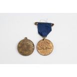 A city of Carlisle 1902 coronation medallion together with a similar 1935 silver jubilee medallion