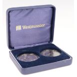 A cased Westminster Queen Elizabeth II 80th Birthday five pound coin pair