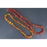 Two late 20th Century amber necklaces, comprising graduated carnelian beads interspersed with