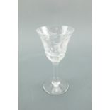 A set of six Royal Brierley wine glasses, having wheel cut floral decoration, (two having nibbles to