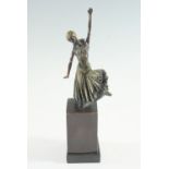 An Art Deco cold-painted and parcel gilt bronze sculpture of a dancer, on bronze plinth, its