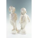 A pair of large ceramic boy and girl figurines, 53 cm tallest