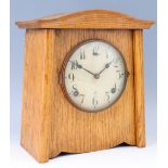 An American L Gilbert Clock Company oak cased arts and crafts influenced mantle clock, striking on a