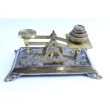 A set of early 20th Century cast brass postal scales, and a cast brass ink standish, (later