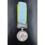 A Crimea Medal with Sebastopol clasp to Private William Carter, Grenadier Guards
