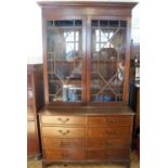 A late 19th / early 20th Century Georgian style astragal-glazed mahogany bookcase on chest, 112 cm x