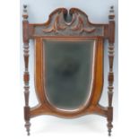 A Victorian mahogany-framed shield-shaped wall mirror, 52 cm x 37 cm