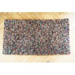 A hand crafted hooky mat / rag rug, 130 x 70