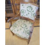A late Victorian upholstered mahogany open armchair