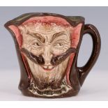 A 1930s Royal Doulton "Mephistopheles" double-faced character jug, with verse to base, printed mark,