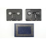 Two Camerascopes stereoscopes with directions for use together with an album of Cavanders Ltd